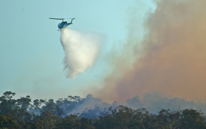 Flying a drone near a bushfire risks $9,000 fine, aviation safety body warns