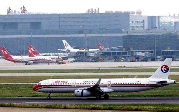 China punishes air traffic controllers for near miss in Shanghai