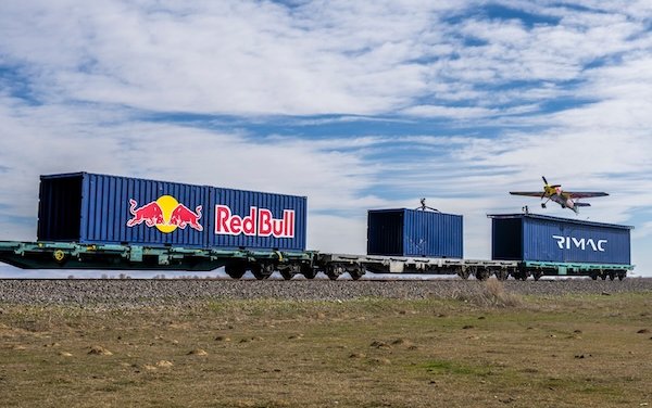 Red Bull athlete Dario Costa lands and takes off from moving train