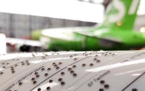 S7 Technics has started production of tactile stickers in Braille for aircraft interiors